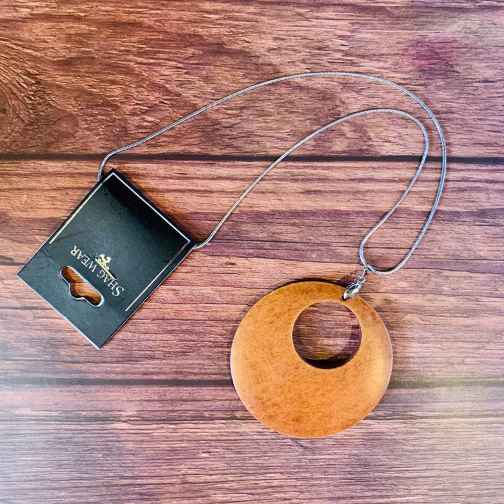 Shagwear wooden pendant on a silver toned chain